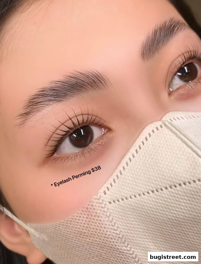 Close-up of a woman's eyes with perfectly shaped eyebrows and lifted eyelashes.