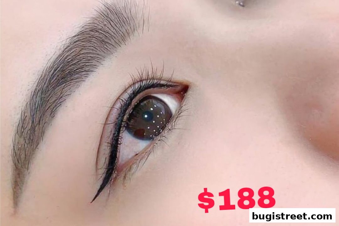 A close-up of a woman's eye with perfectly shaped eyebrows and eyeliner.