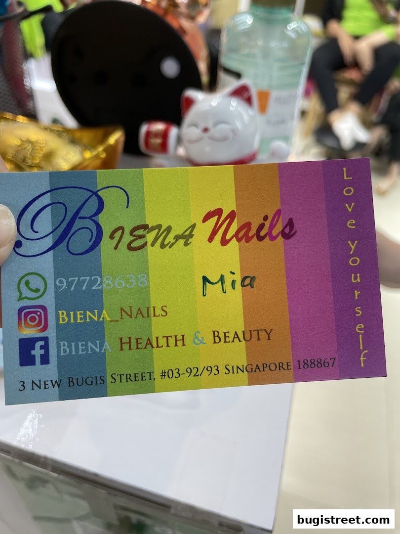 A business card for Biena Nails with contact information and social media handles.