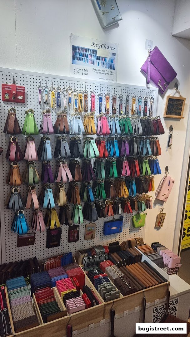 A display of colorful keychains and wallets at Boutique Accessories.