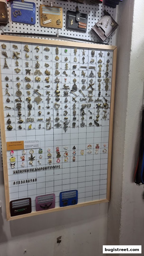 A display board filled with various charms and accessories, with cardholders above.