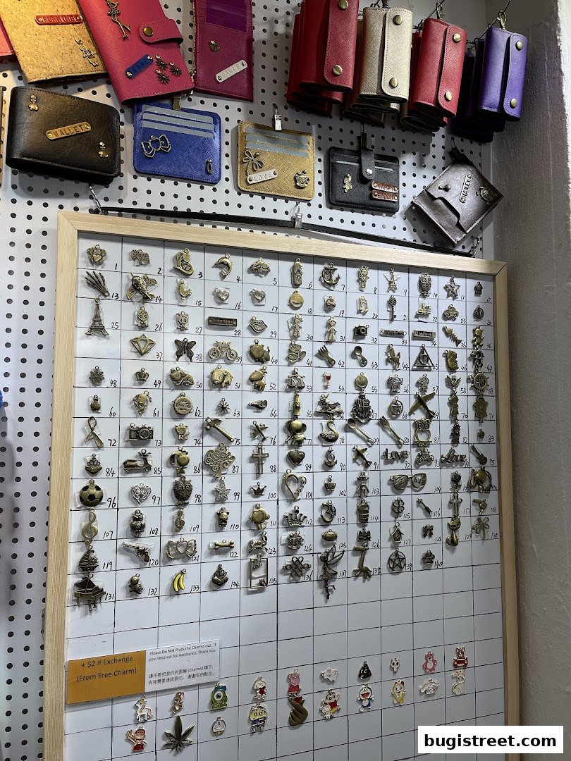 A display of various charms and wallets at Boutique Accessories.