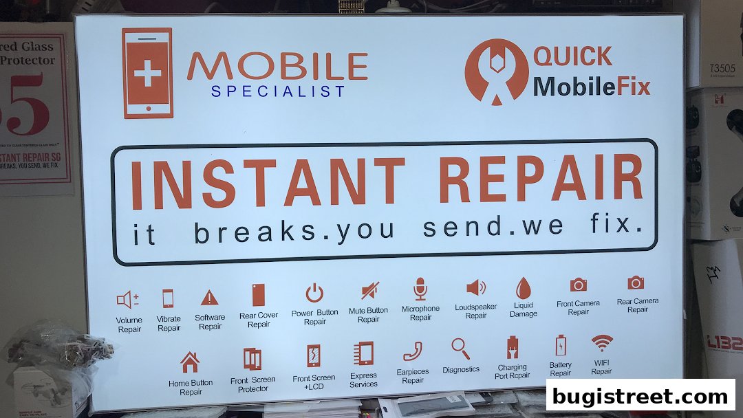 A sign for Quick Mobile Fix offering instant mobile repair services for various issues.