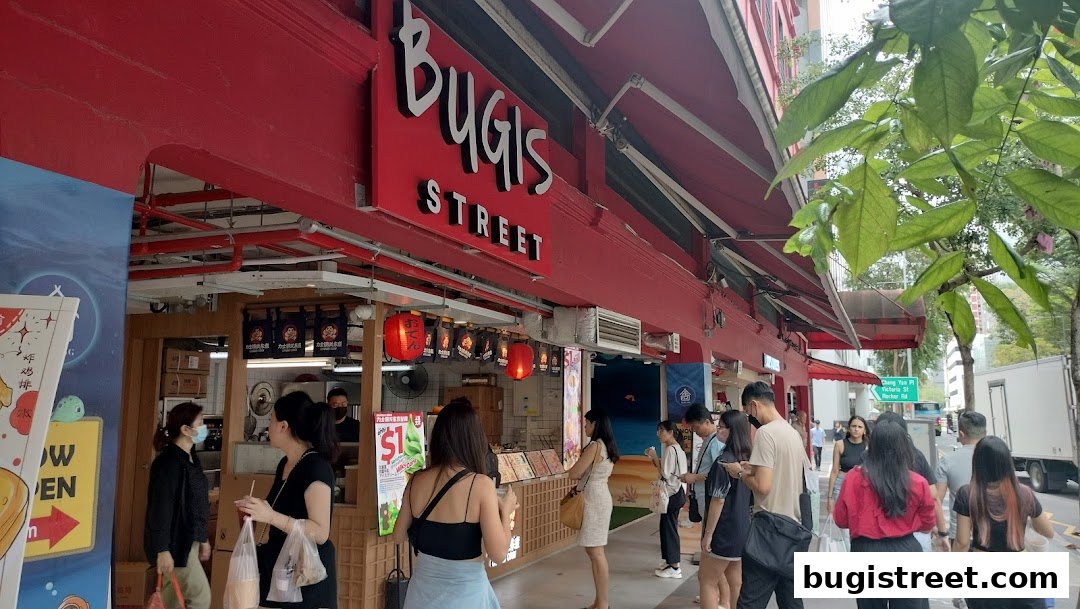 A street view of a Japanese food stall with customers queuing and a prominent red sign.