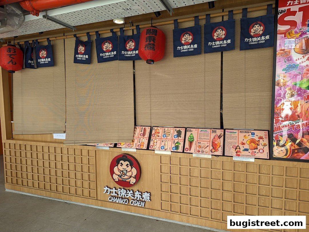 The storefront of Chanko Oden features Japanese lanterns, branded banners, and displayed menus with food items.