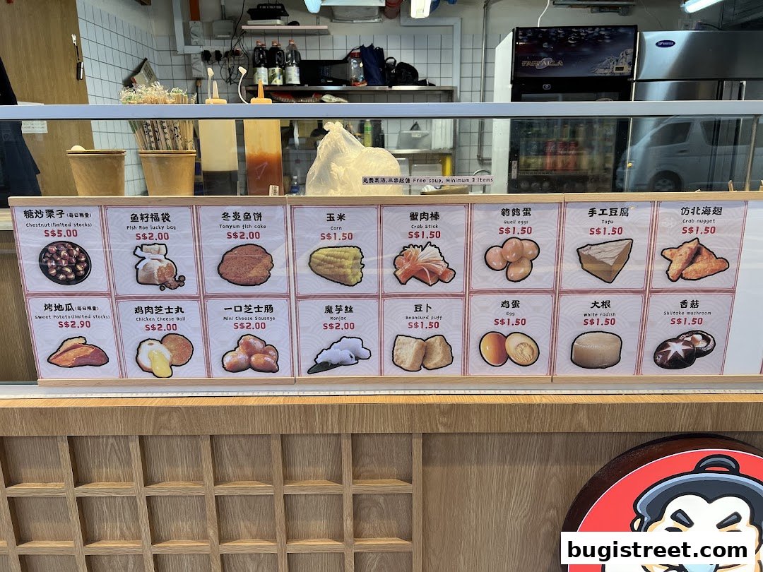A display of various food items with their names and prices, likely for a Japanese oden shop.