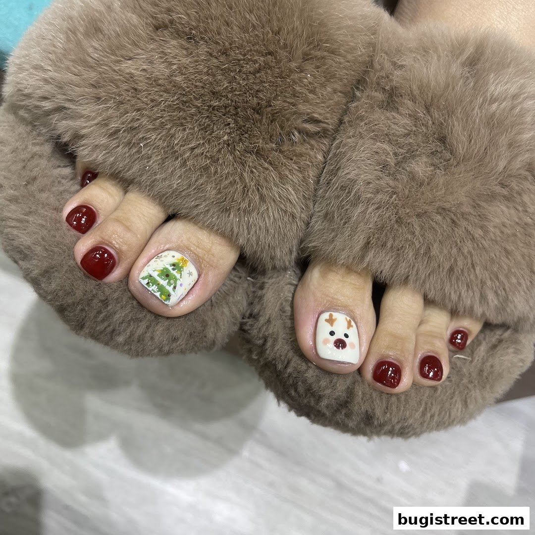 Close-up of feet with festive Christmas-themed toenail art and cozy slippers.