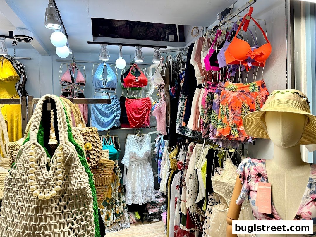 A vibrant boutique interior showcasing a variety of summer fashion, including swimwear, dresses, and accessories.