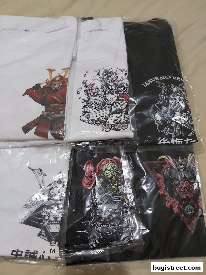 A collection of t-shirts featuring Japanese-inspired warrior and mythical creature designs.