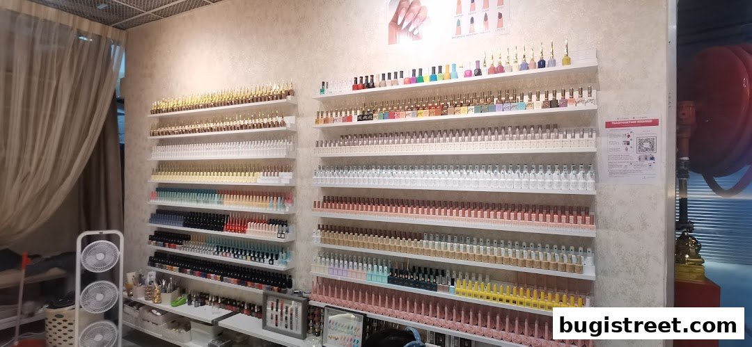 Shelves filled with a wide variety of nail polish bottles in different colors.