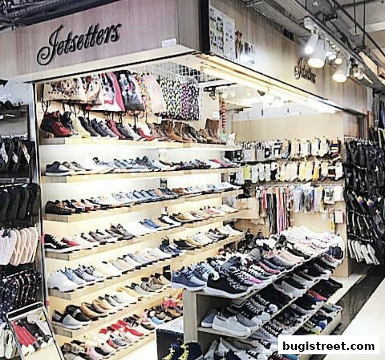 A well-stocked shoe store with shelves displaying a wide variety of footwear and accessories.