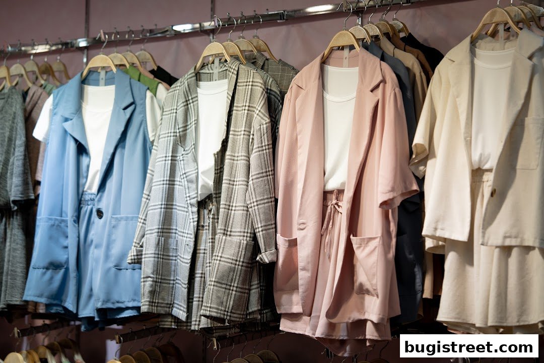 A selection of stylish women's blazers and matching shorts on hangers.