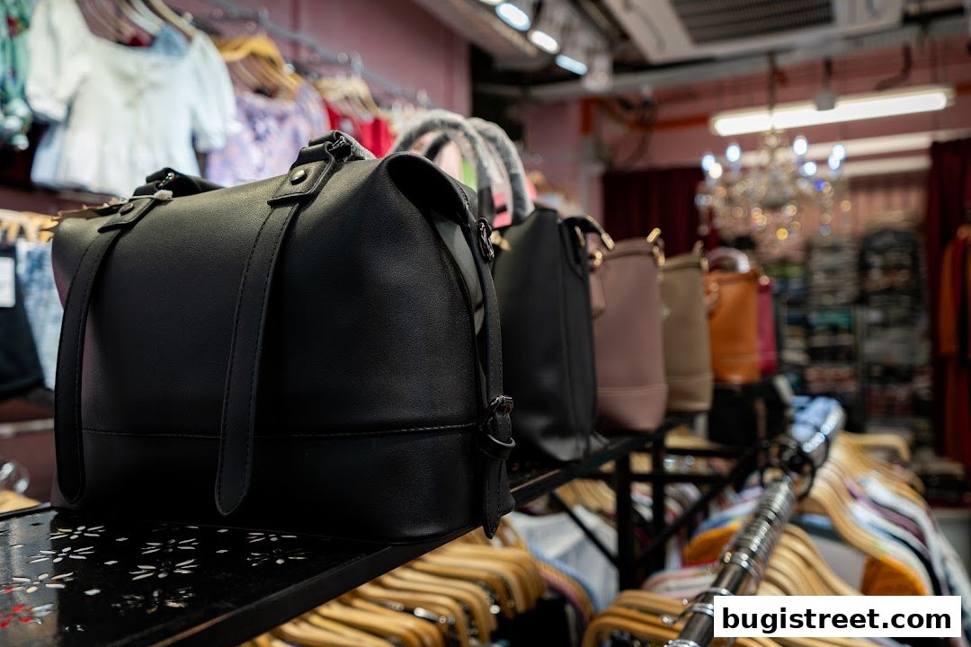 A display of stylish handbags and clothing inside a boutique.