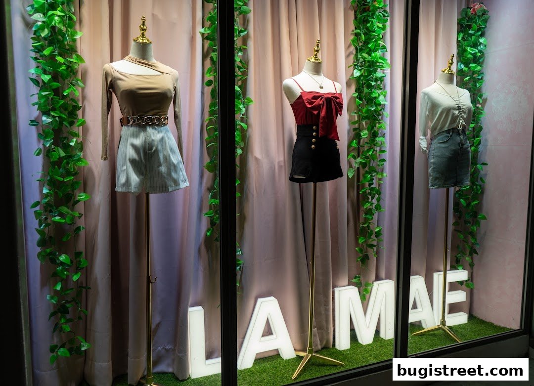 La Mae Boutique shop window display featuring three mannequins dressed in stylish outfits.