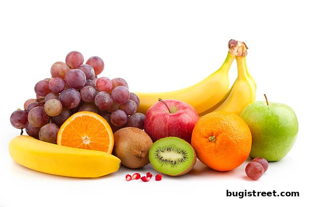 A vibrant assortment of fresh fruits including grapes, bananas, apples, oranges, and kiwi.