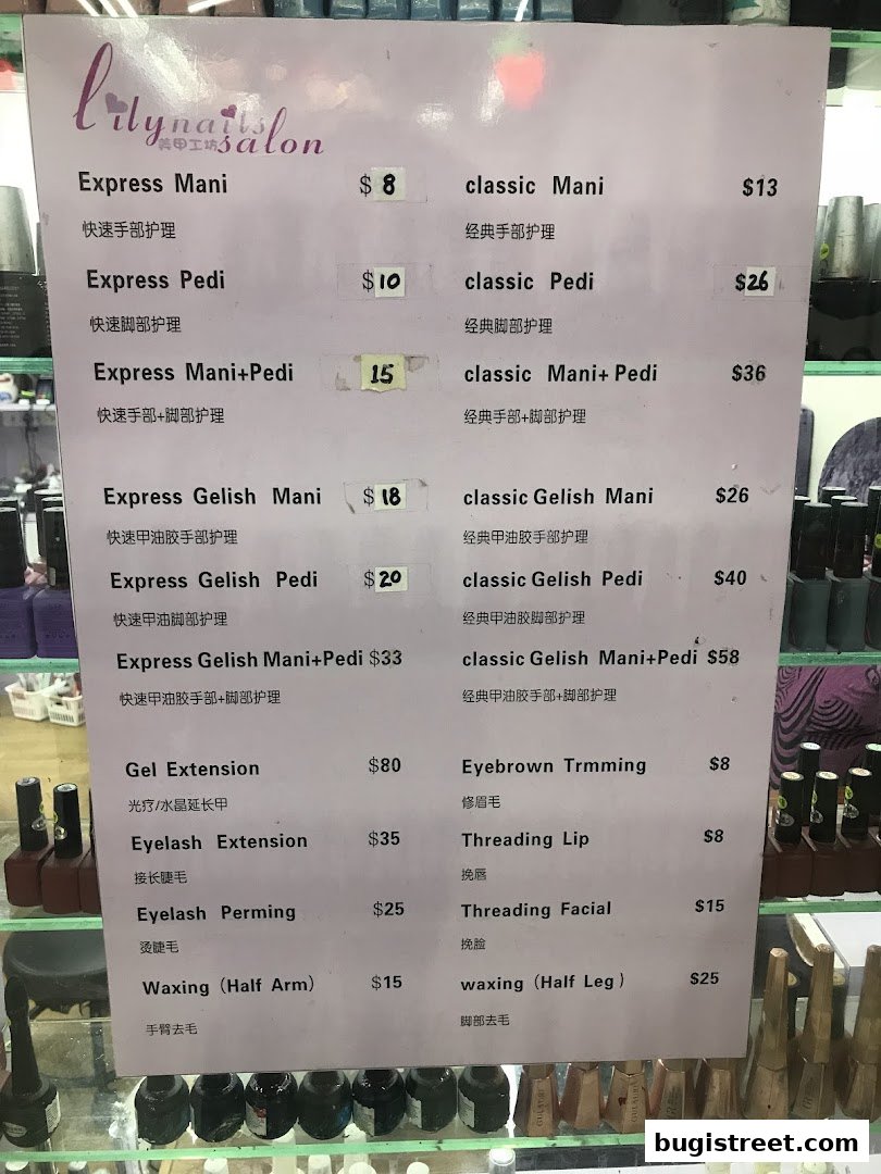 A menu board for Lily Nails Salon, listing various nail and beauty services with prices.