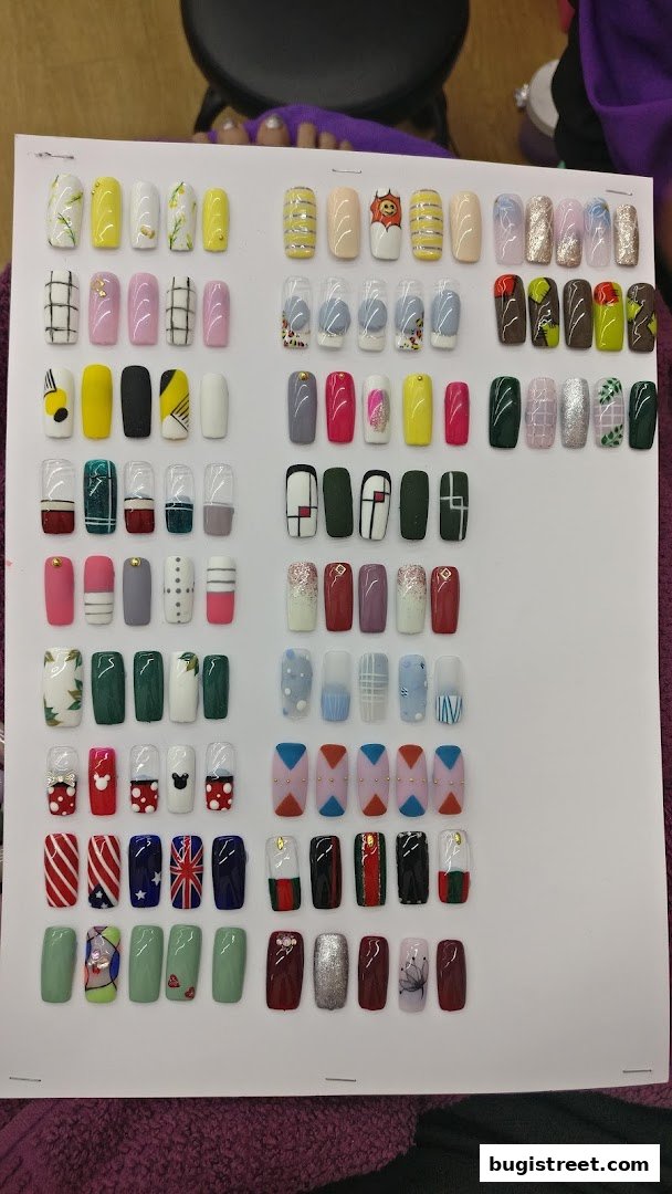 A display of various artificial nails with different designs and colors.