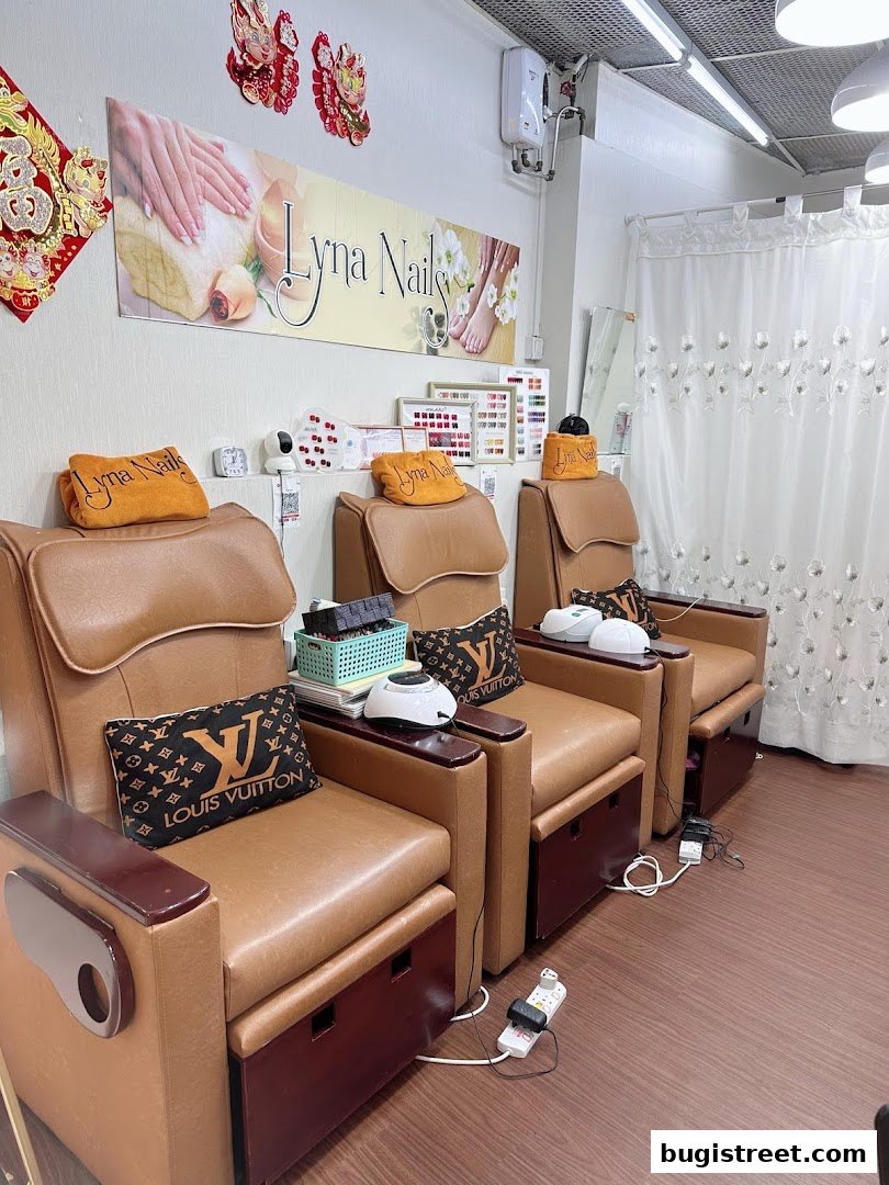 Interior shot of Lyna Nails salon with pedicure chairs and nail polish displays.