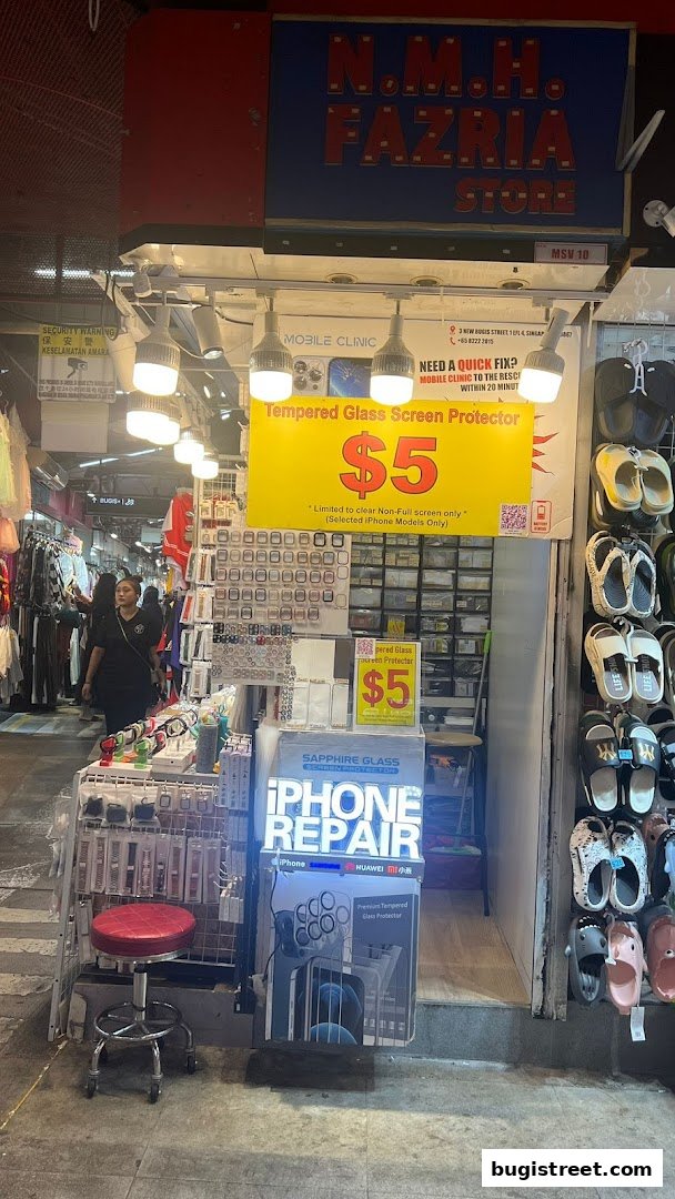 A mobile clinic shop offering iPhone repair and screen protectors with a $5 special.