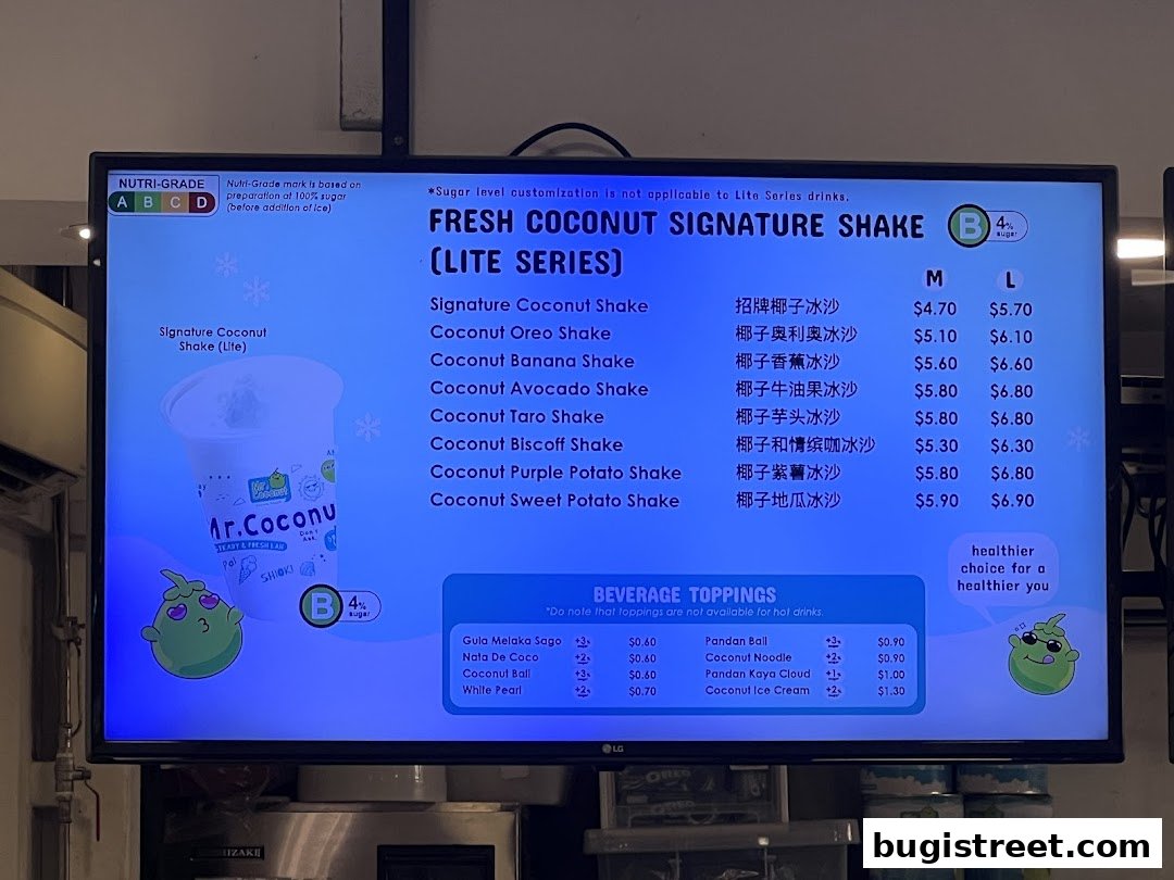 A digital menu board displaying fresh coconut signature shakes and beverage toppings.
