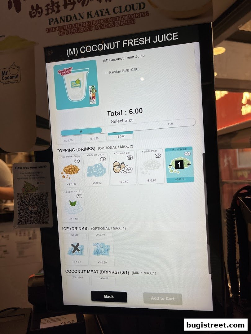 A digital menu screen displaying options for coconut fresh juice with various toppings and ice preferences.