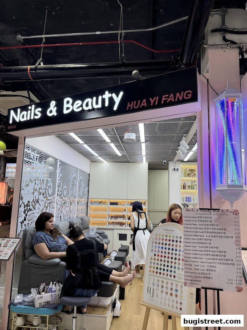 Nails & Beauty Hua Yi Fang shop interior with customers receiving manicures and pedicures.