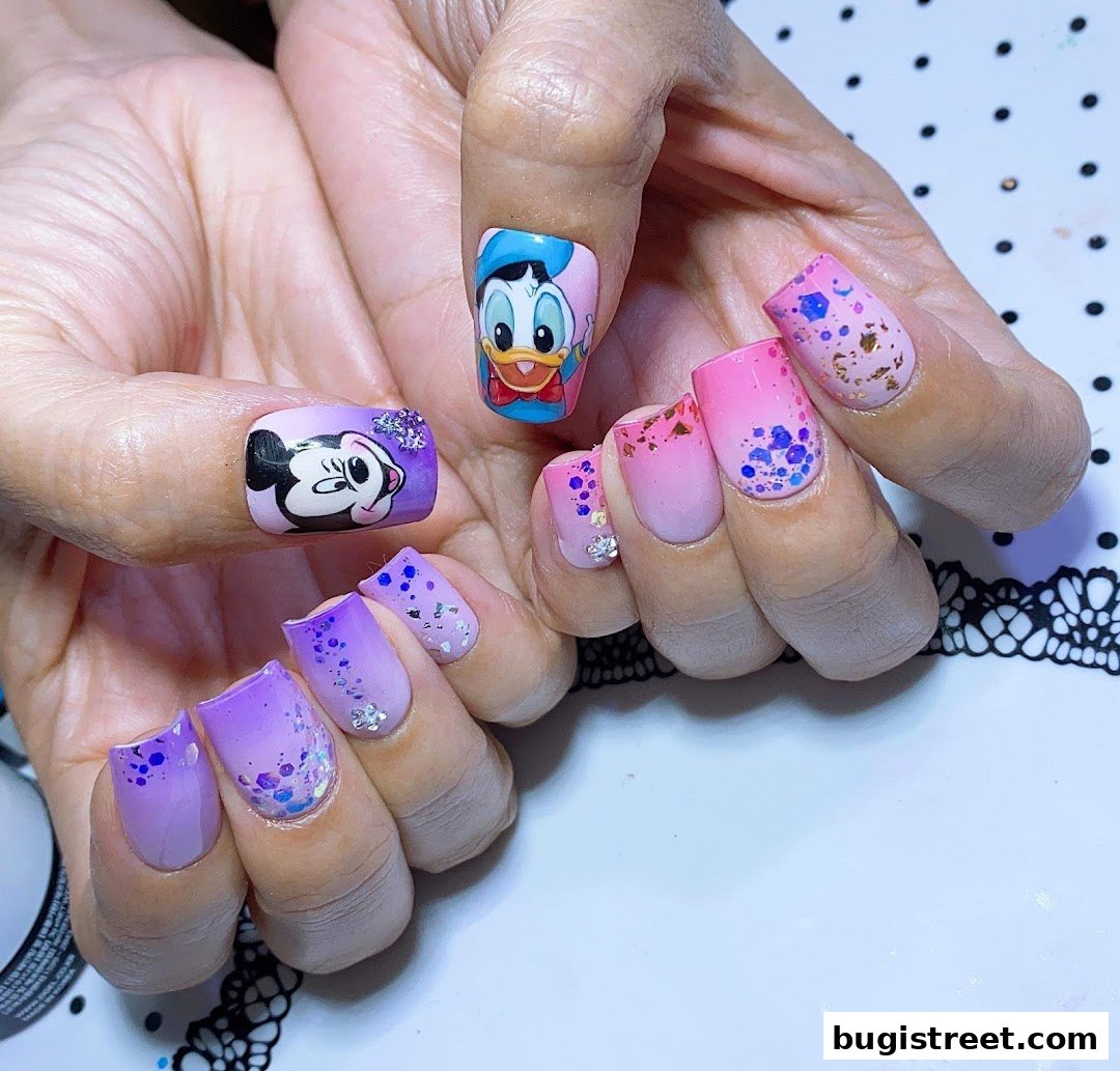 Close-up of hands with intricate Disney-themed nail art featuring Mickey Mouse and Donald Duck.