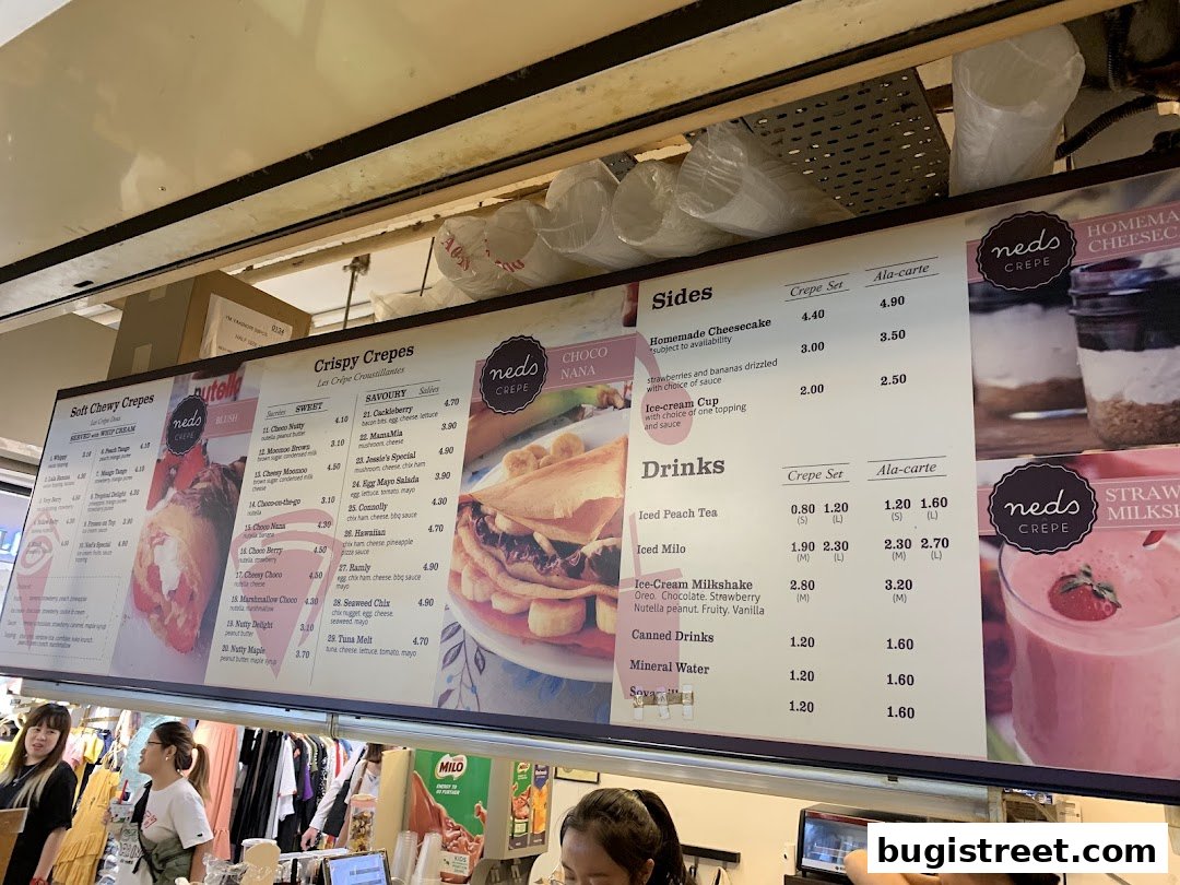 A menu board for Neds Crepes & Coffee, displaying various crepe, side, and drink options.