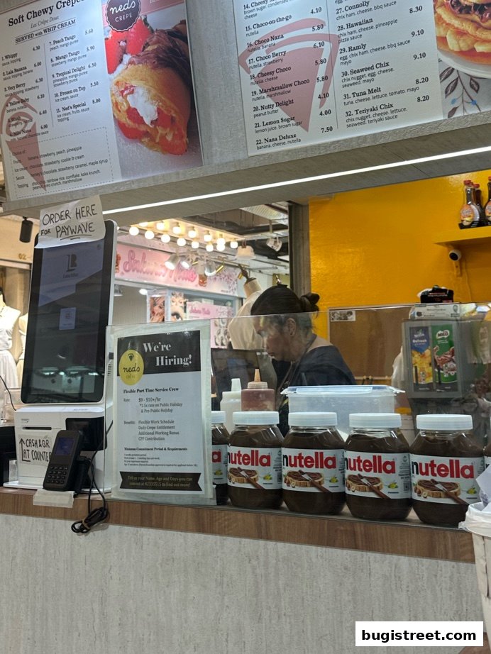 A close-up view of a crepe shop's menu board, showcasing various sweet and savory crepe options.