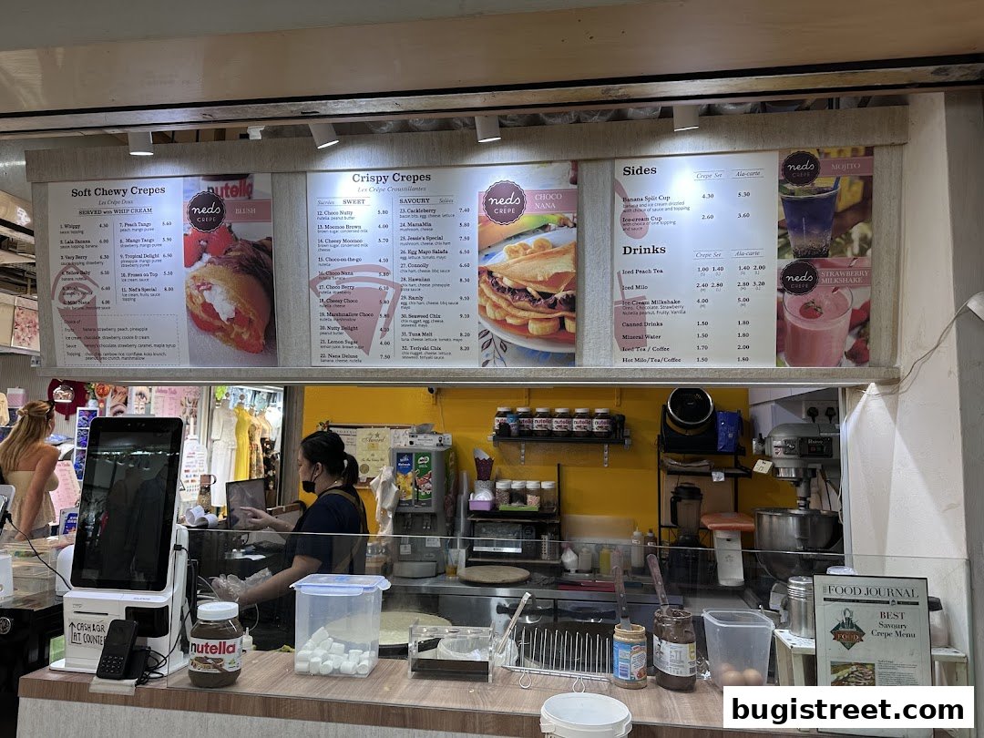 A menu board displaying various crepe and drink options at Neds Crepes & Coffee.