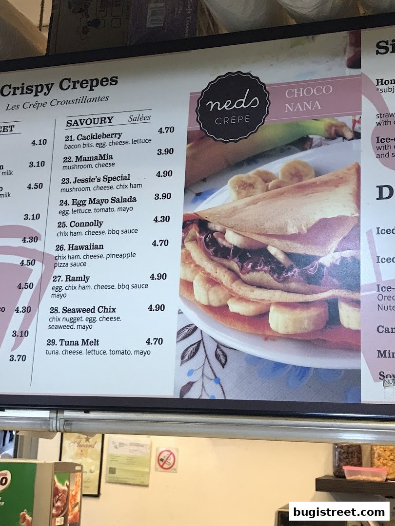 A menu board for Neds Crepes featuring savory crepes and a Choco Nana crepe.