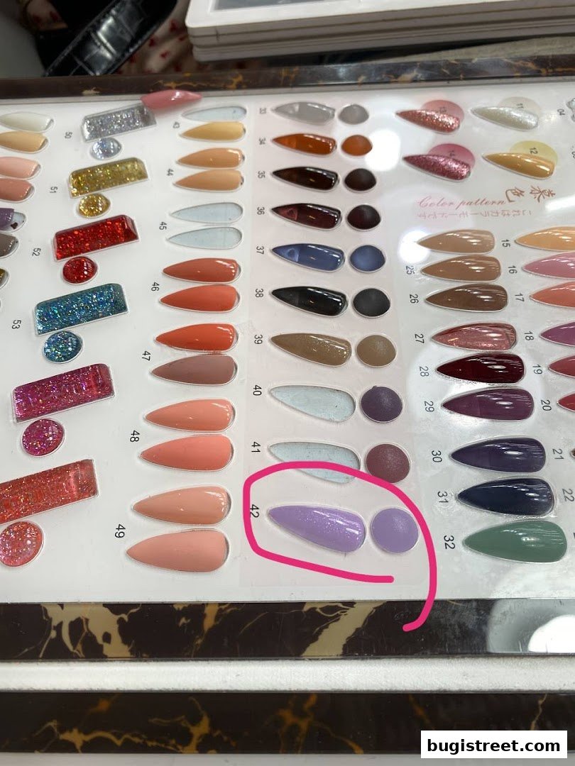 A display of various nail polish colors and finishes, organized by number.