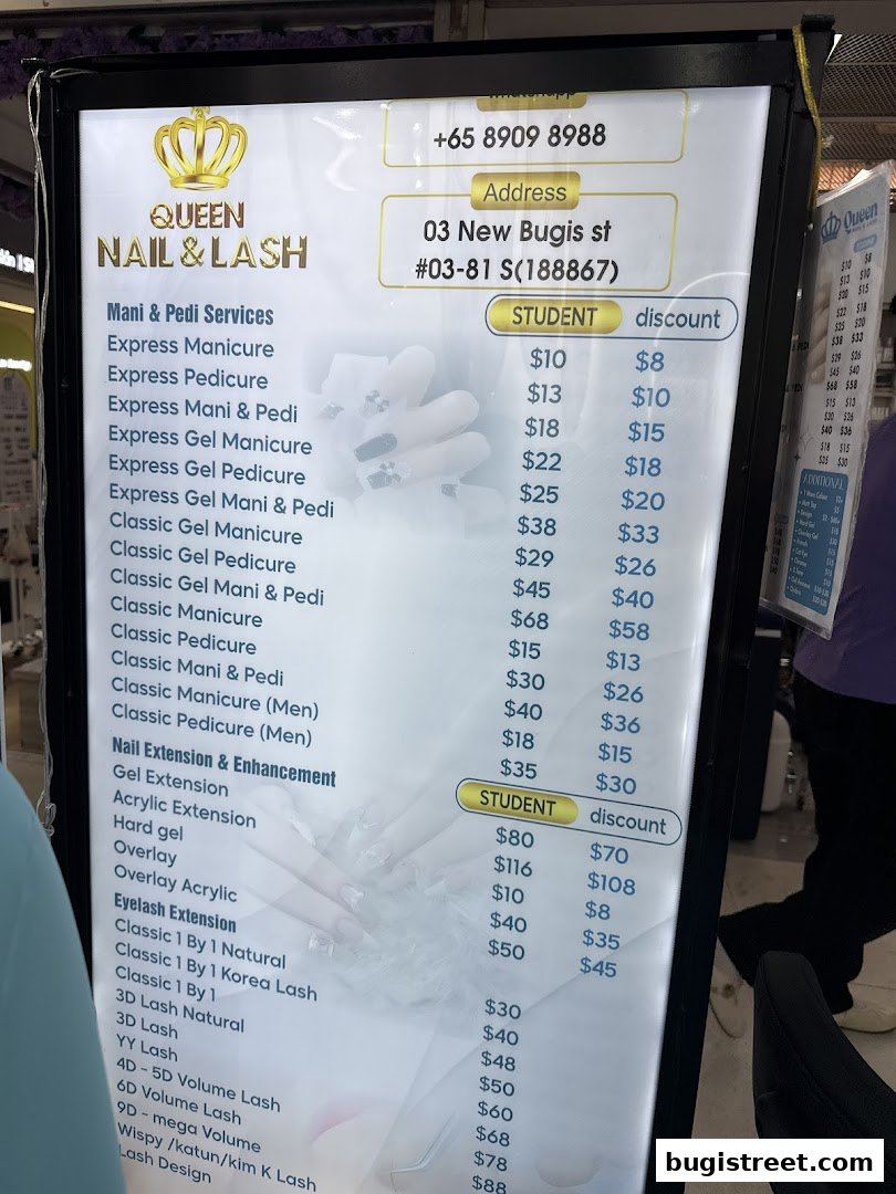 A menu board for Queen Nail & Lash, displaying prices for various nail and eyelash services.