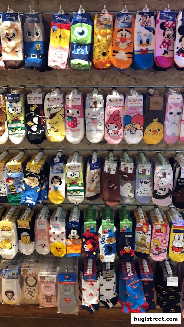 A display of colorful socks featuring various cartoon characters and designs.
