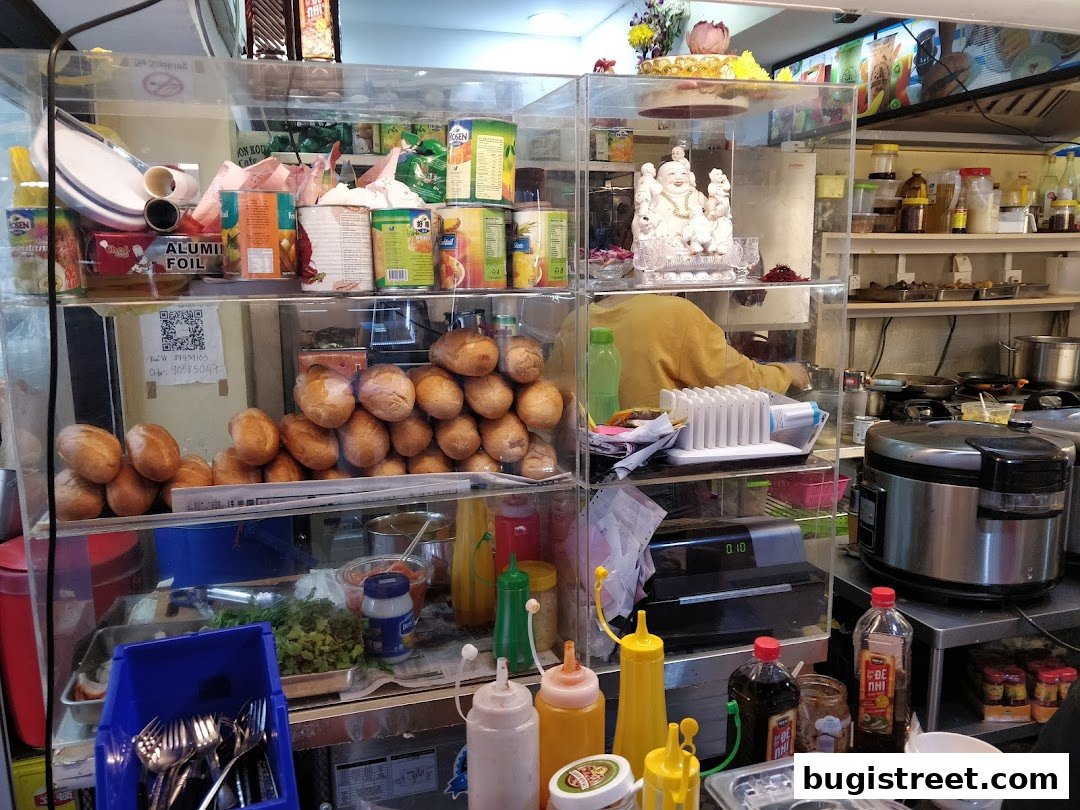 A display of fresh bread rolls, condiments, and kitchen supplies at Shoon Kou Cafe.