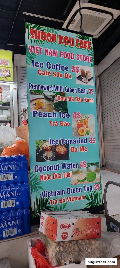 A vertical menu board for Shoon Kou Cafe, featuring Vietnamese drinks and their prices.