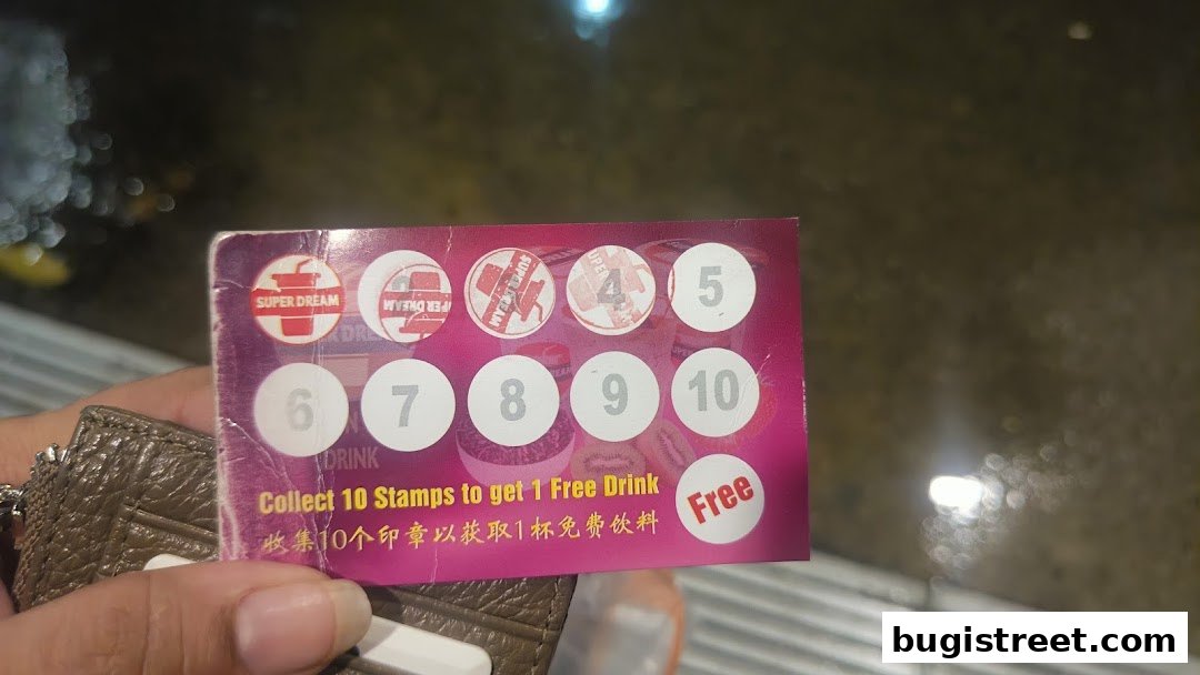 A loyalty card from Super Dream offering a free drink after collecting 10 stamps.