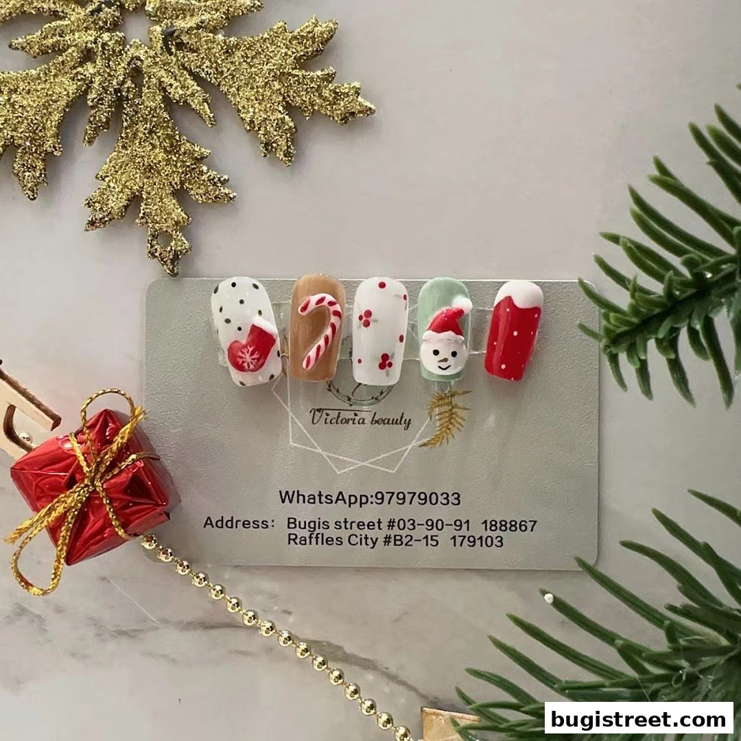 Festive Christmas-themed nail art samples displayed with holiday decorations.