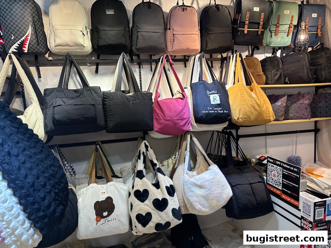 A display of various backpacks and tote bags in different styles and colors.