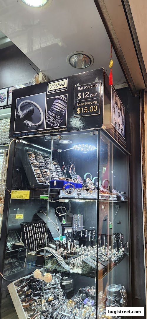 A display case filled with various jewelry items, including bracelets, necklaces, and earrings.